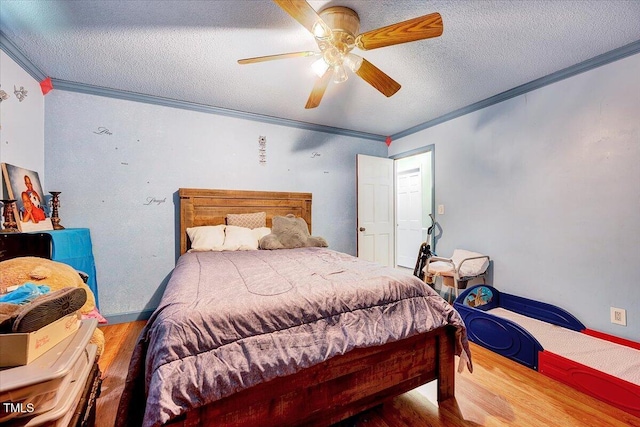 750 Greenleaf Rd, Angier, NC 27501 - bedroom featuring crown molding, wood finished floors, a textured ceiling, and ceiling fan