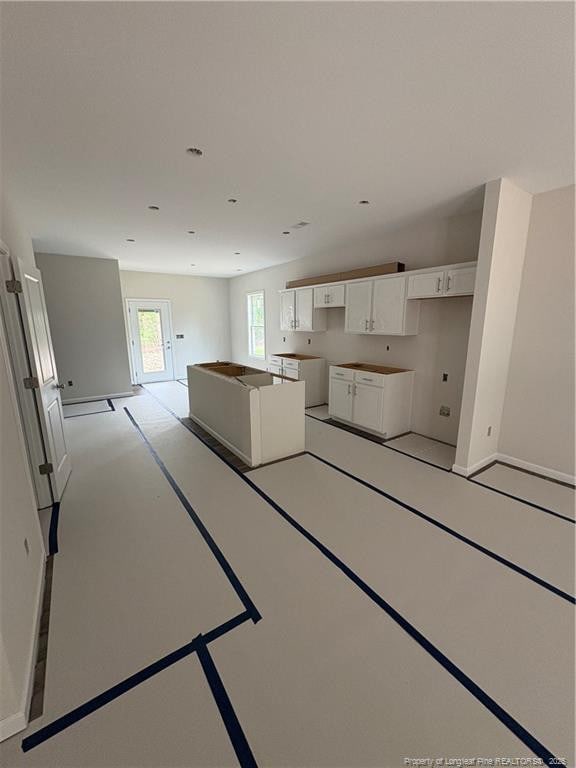 924 Stevens St, Raeford, NC 28376 - kitchen featuring white cabinetry and baseboards