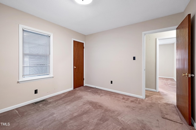 2016 Tryon Rd, Raleigh, NC 27603 - unfurnished room with carpet flooring and baseboards