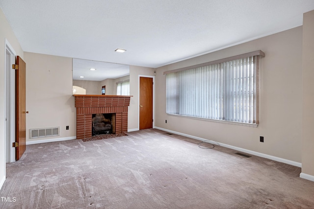 2016 Tryon Rd, Raleigh, NC 27603 - unfurnished living room featuring carpet floors, baseboards, and a fireplace