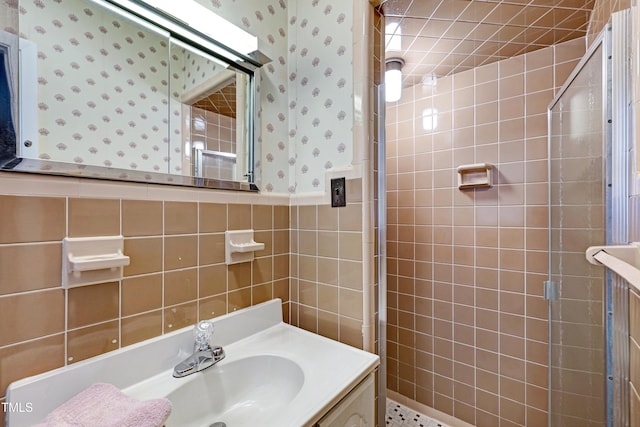 2016 Tryon Rd, Raleigh, NC 27603 - full bath featuring wallpapered walls, a shower stall, vanity, and tile walls