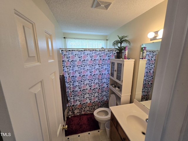 5810 Stardust Ct, Durham, NC 27712 - full bathroom with vanity, toilet, a textured ceiling, and curtained shower