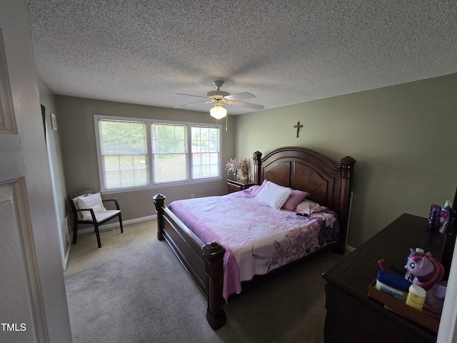 5810 Stardust Ct, Durham, NC 27712 - bedroom with carpet flooring, a ceiling fan, and a textured ceiling