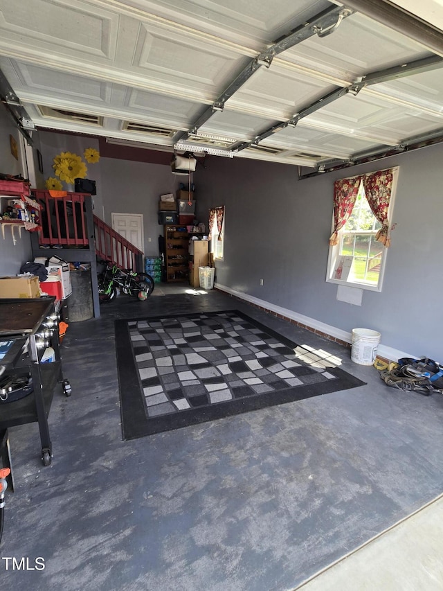 5810 Stardust Ct, Durham, NC 27712 - garage featuring a garage door opener