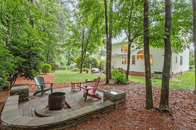 4329 Hawksong Pl, Cary, NC 27518 - view of patio / terrace with an outdoor fire pit