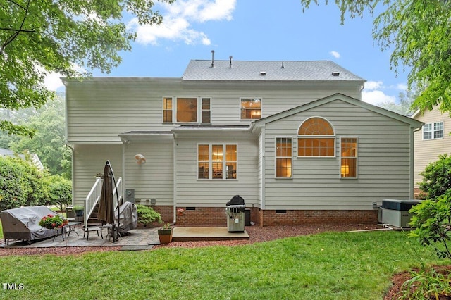 4329 Hawksong Pl, Cary, NC 27518 - back of house featuring a patio area, crawl space, a lawn, and central AC