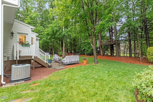 4329 Hawksong Pl, Cary, NC 27518 - view of green lawn featuring central air condition unit and view of scattered trees