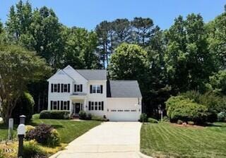4329 Hawksong Pl, Cary, NC 27518 - view of front of property with driveway, a front lawn, and a garage