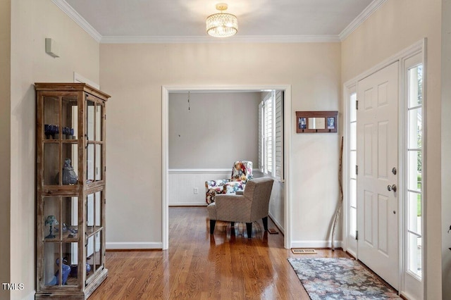 4329 Hawksong Pl, Cary, NC 27518 - foyer with wood finished floors, crown molding, a chandelier, and baseboards
