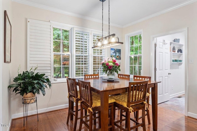 4329 Hawksong Pl, Cary, NC 27518 - dining room with wood finished floors, crown molding, and baseboards