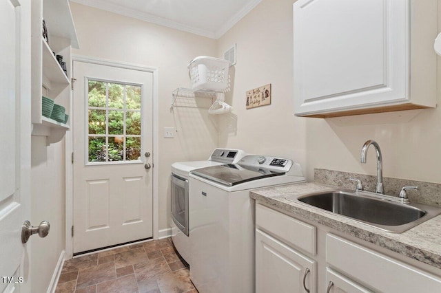 4329 Hawksong Pl, Cary, NC 27518 - laundry area featuring independent washer and dryer, cabinet space, crown molding, baseboards, and stone finish floors