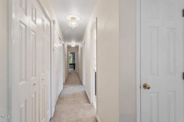 4329 Hawksong Pl, Cary, NC 27518 - hallway featuring light carpet and baseboards