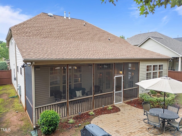 7768 Berry Crest Ave, Raleigh, NC 27617 - rear view of property with a patio area, roof with shingles, and a sunroom
