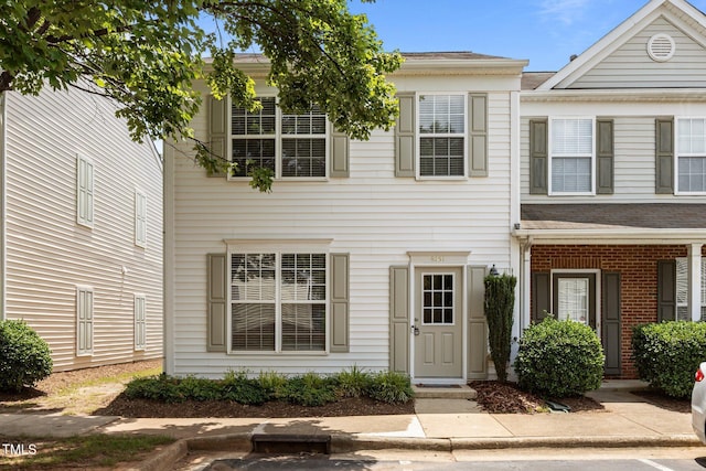 8151 Rhiannon Rd, Raleigh, NC 27613 - view of property featuring brick siding and roof with shingles