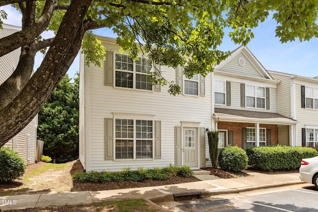 8151 Rhiannon Rd, Raleigh, NC 27613 - townhome / multi-family property with uncovered parking and brick siding