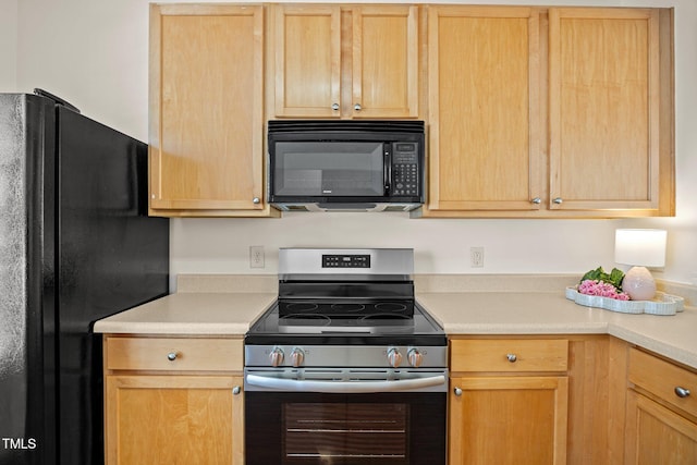8151 Rhiannon Rd, Raleigh, NC 27613 - kitchen with black appliances, light countertops, and light brown cabinets