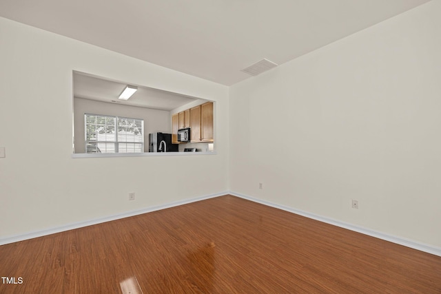 8151 Rhiannon Rd, Raleigh, NC 27613 - unfurnished room featuring wood finished floors and baseboards