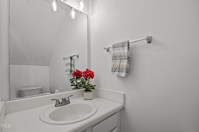 8151 Rhiannon Rd, Raleigh, NC 27613 - bathroom featuring vanity and vaulted ceiling