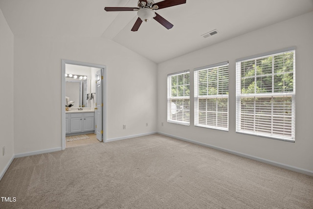 8151 Rhiannon Rd, Raleigh, NC 27613 - unfurnished bedroom with lofted ceiling, light carpet, ensuite bath, and a ceiling fan