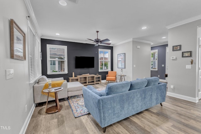 533 Duchart Ln, Fuquay Varina, NC 27526 - living area featuring wood finished floors, baseboards, plenty of natural light, recessed lighting, and crown molding
