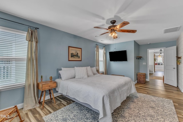 533 Duchart Ln, Fuquay Varina, NC 27526 - bedroom featuring light wood-type flooring, baseboards, and a ceiling fan
