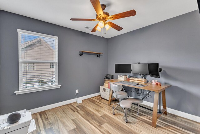 533 Duchart Ln, Fuquay Varina, NC 27526 - office area with wood finished floors, a ceiling fan, and baseboards