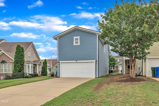 533 Duchart Ln, Fuquay Varina, NC 27526 - view of front of home featuring an attached garage, a front yard, and concrete driveway