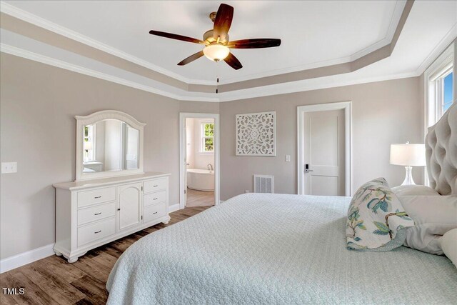 1779 Walter Grissom Rd, Kittrell, NC 27544 - bedroom with wood finished floors, a raised ceiling, ornamental molding, baseboards, and ensuite bath
