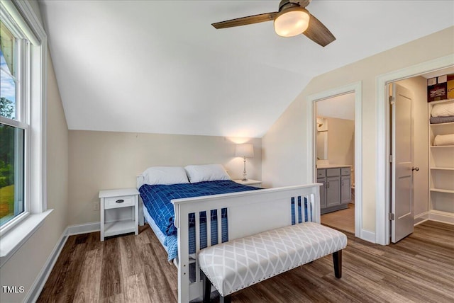1779 Walter Grissom Rd, Kittrell, NC 27544 - bedroom with wood finished floors, multiple windows, lofted ceiling, baseboards, and connected bathroom