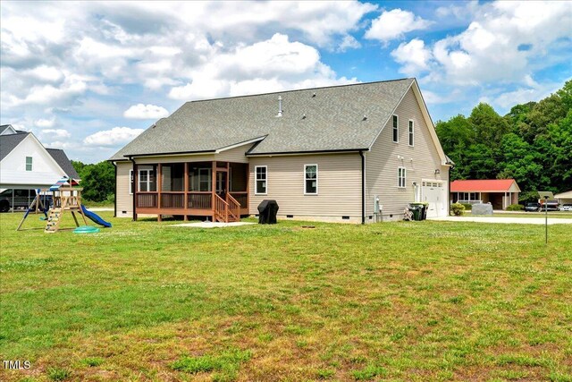 1779 Walter Grissom Rd, Kittrell, NC 27544 - back of property with a sunroom, crawl space, a playground, an attached garage, and a yard