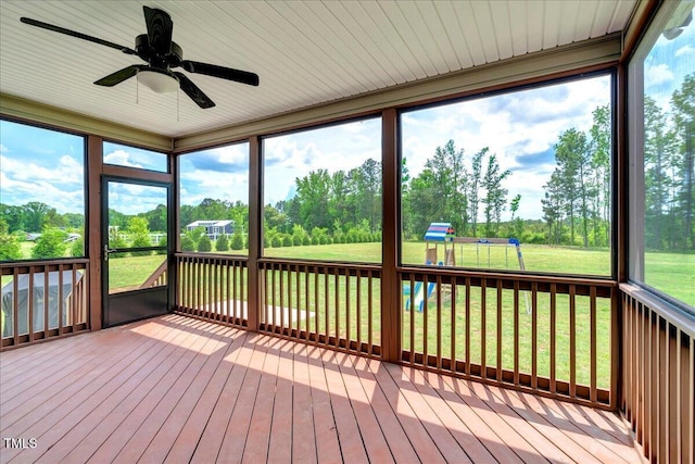 1779 Walter Grissom Rd, Kittrell, NC 27544 - unfurnished sunroom featuring a ceiling fan, healthy amount of natural light, and view of scattered trees