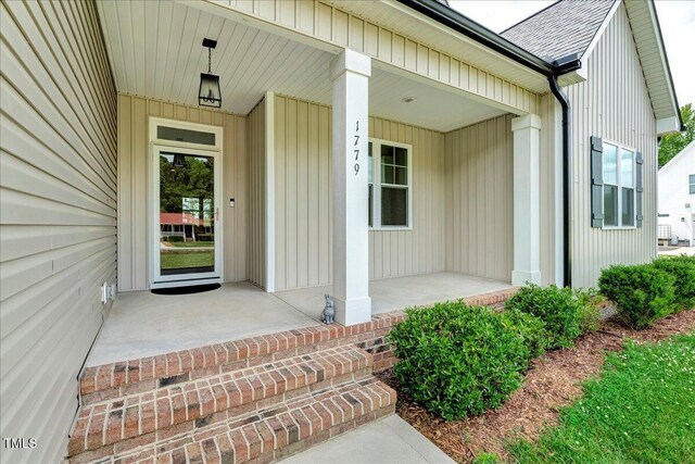 1779 Walter Grissom Rd, Kittrell, NC 27544 - doorway to property featuring a porch and a shingled roof