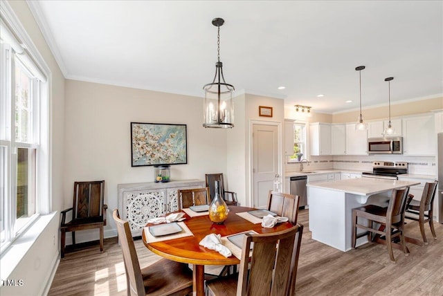 1779 Walter Grissom Rd, Kittrell, NC 27544 - dining room with light wood-style floors, crown molding, recessed lighting, and baseboards