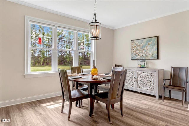 1779 Walter Grissom Rd, Kittrell, NC 27544 - dining room featuring a chandelier, light wood finished floors, plenty of natural light, baseboards, and crown molding