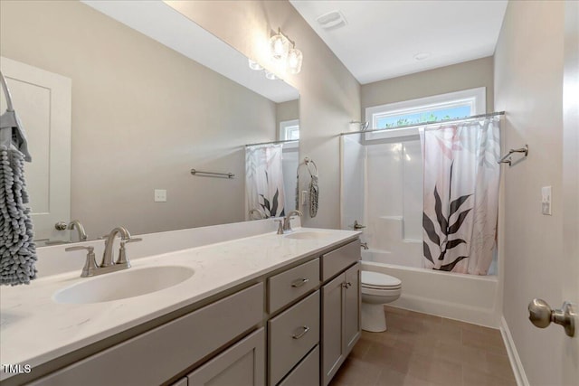 1779 Walter Grissom Rd, Kittrell, NC 27544 - bathroom with toilet, double vanity, shower / tub combo, and baseboards