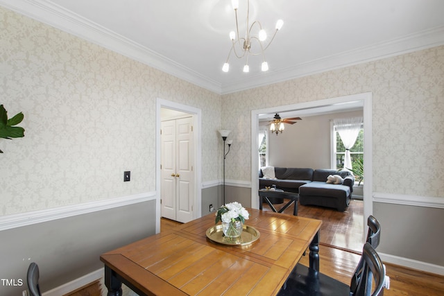 102 W Hill Dr, Cary, NC 27519 - dining room featuring wood finished floors, crown molding, and a chandelier