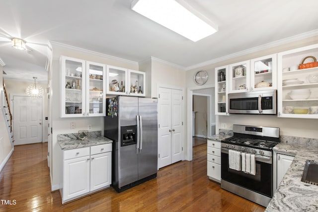 102 W Hill Dr, Cary, NC 27519 - kitchen with appliances with stainless steel finishes, crown molding, white cabinetry, light stone countertops, and dark wood-style floors
