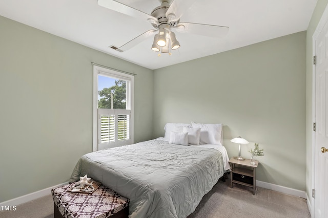 102 W Hill Dr, Cary, NC 27519 - bedroom with light colored carpet, baseboards, and a ceiling fan