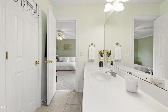 102 W Hill Dr, Cary, NC 27519 - ensuite bathroom with tile patterned flooring, vanity, ceiling fan, and baseboards