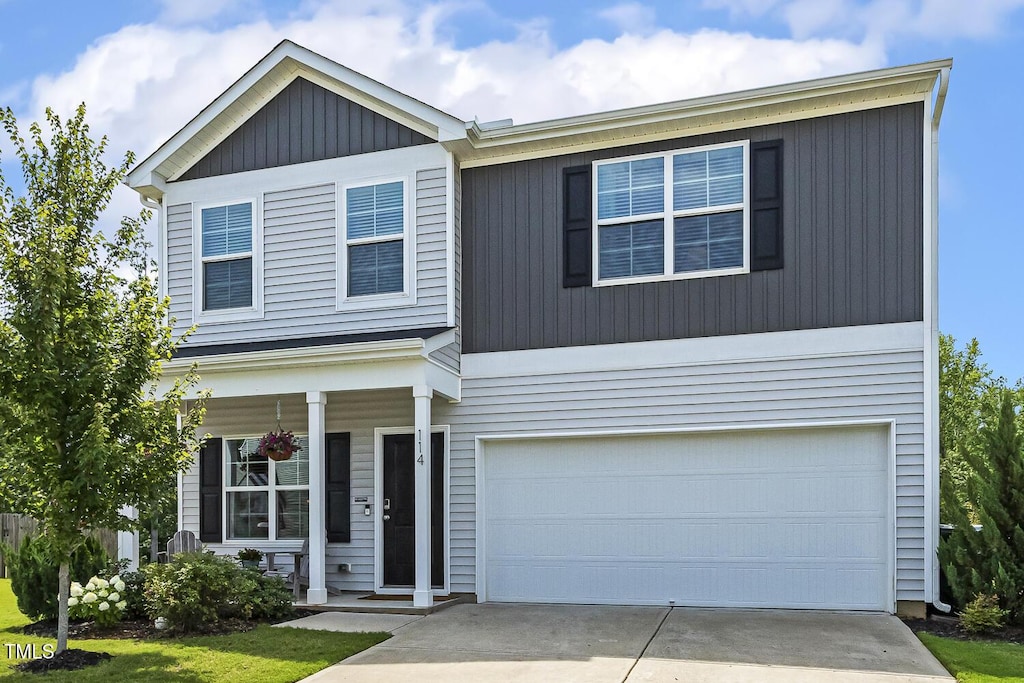 114 Forest Meadow Ct, Garner, NC 27529 - view of front of property featuring concrete driveway, a garage, and a porch