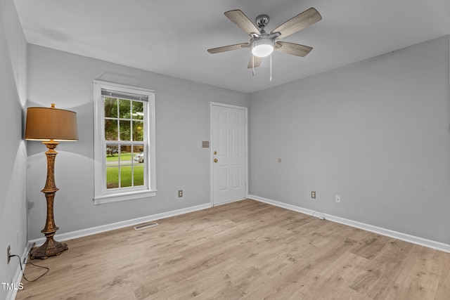 627 Gaslight Trl, Wendell, NC 27591 - spare room with light wood-style flooring, baseboards, and a ceiling fan