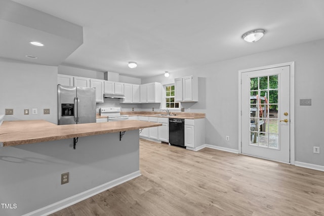 627 Gaslight Trl, Wendell, NC 27591 - kitchen with stainless steel fridge with ice dispenser, black dishwasher, white electric range, a sink, and a breakfast bar