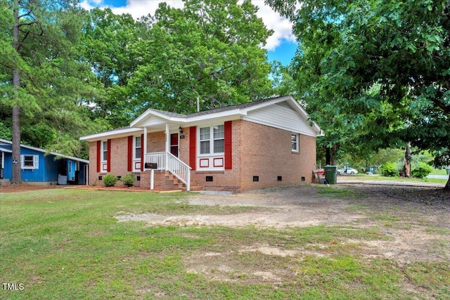 101 Apollo Cir, Roanoke Rapids, NC 27870 - ranch-style home with crawl space, brick siding, a front yard, covered porch, and view of scattered trees