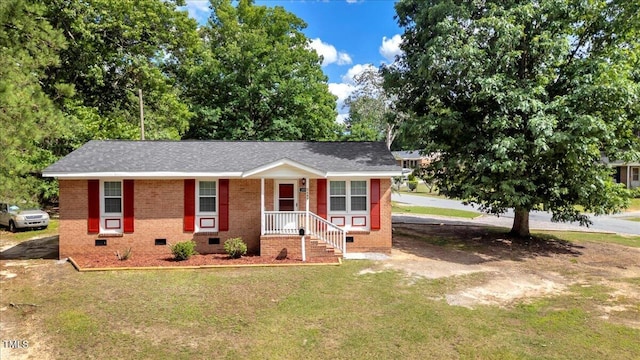 101 Apollo Cir, Roanoke Rapids, NC 27870 - view of front facade with crawl space, a front yard, and brick siding