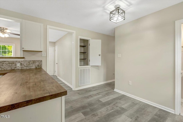 101 Apollo Cir, Roanoke Rapids, NC 27870 - unfurnished dining area with light wood finished floors, baseboards, and ceiling fan