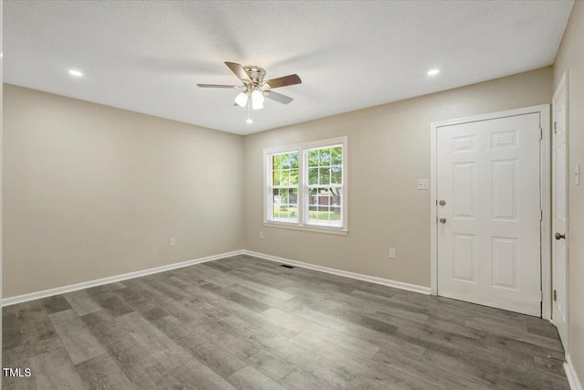 101 Apollo Cir, Roanoke Rapids, NC 27870 - empty room featuring ceiling fan, wood finished floors, baseboards, and recessed lighting