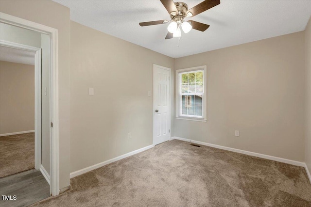 101 Apollo Cir, Roanoke Rapids, NC 27870 - spare room with carpet, baseboards, and ceiling fan