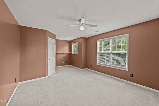 1604 Carnation Dr, Durham, NC 27703 - spare room with a ceiling fan, baseboards, and carpet floors