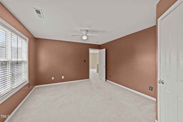 1604 Carnation Dr, Durham, NC 27703 - unfurnished room featuring light carpet, ceiling fan, and baseboards