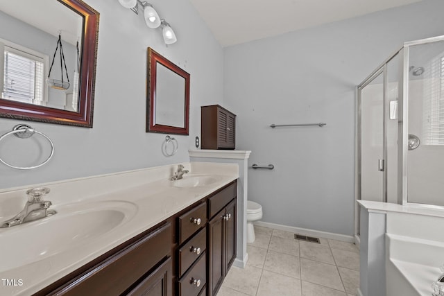 1604 Carnation Dr, Durham, NC 27703 - full bath with a shower stall, toilet, double vanity, a bath, and tile patterned floors